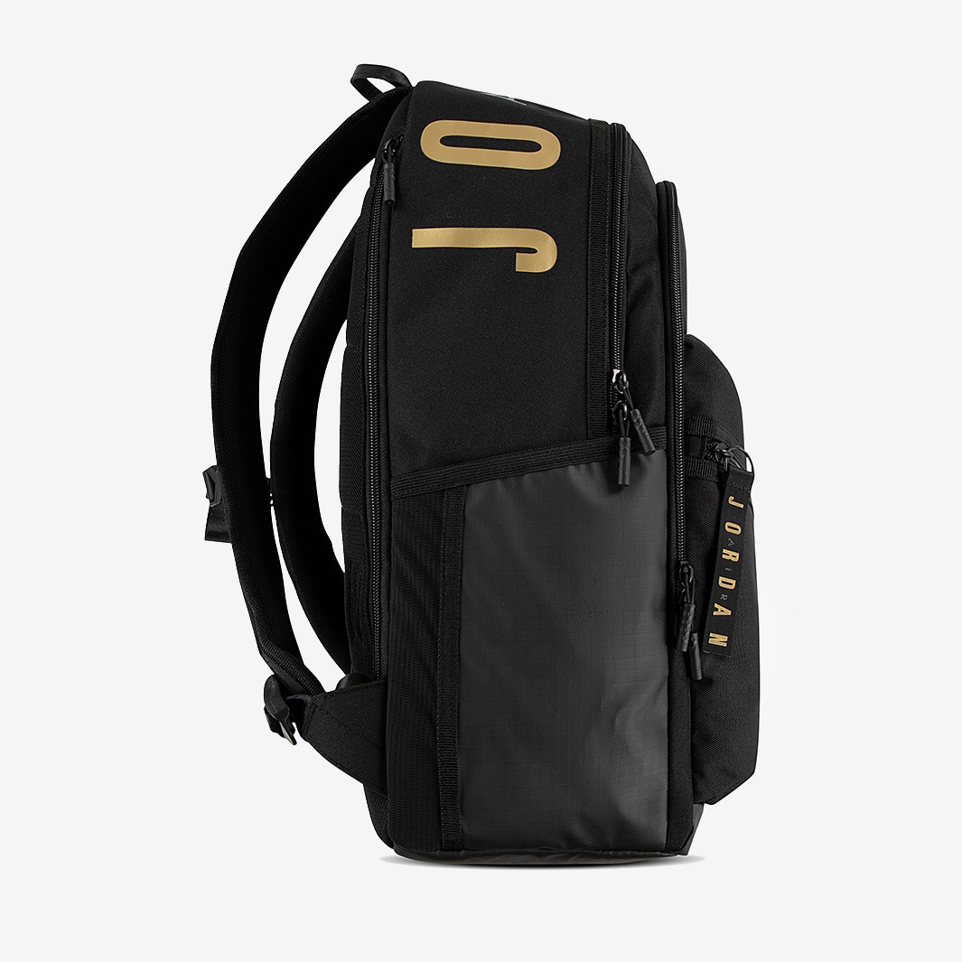 black and gold backpack nike