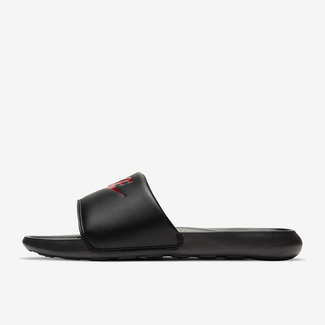 black nike slides with red check