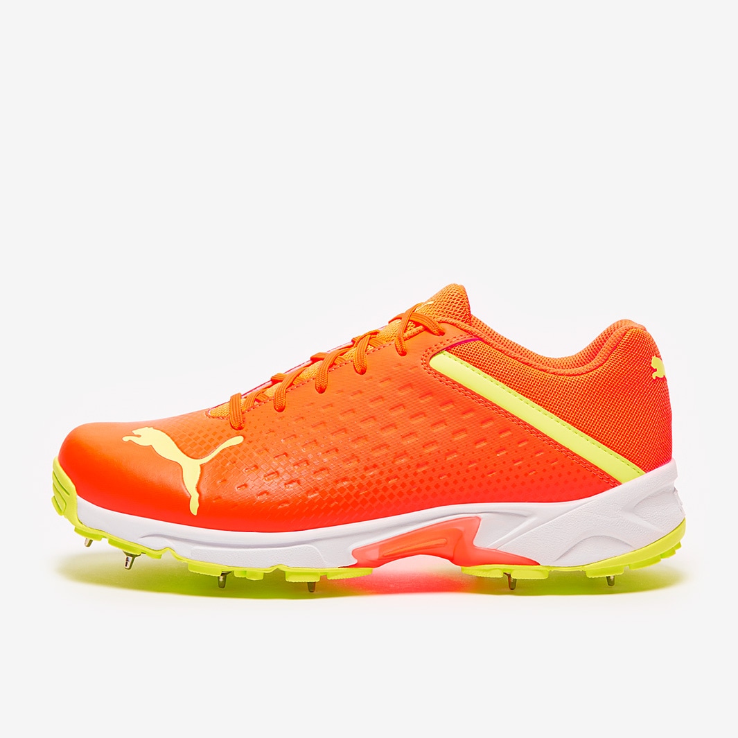 Puma orange 2024 cricket shoes