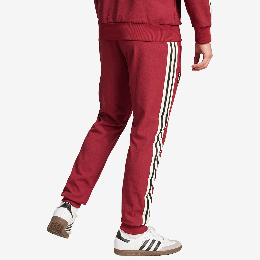 adidas sst track pants maroon