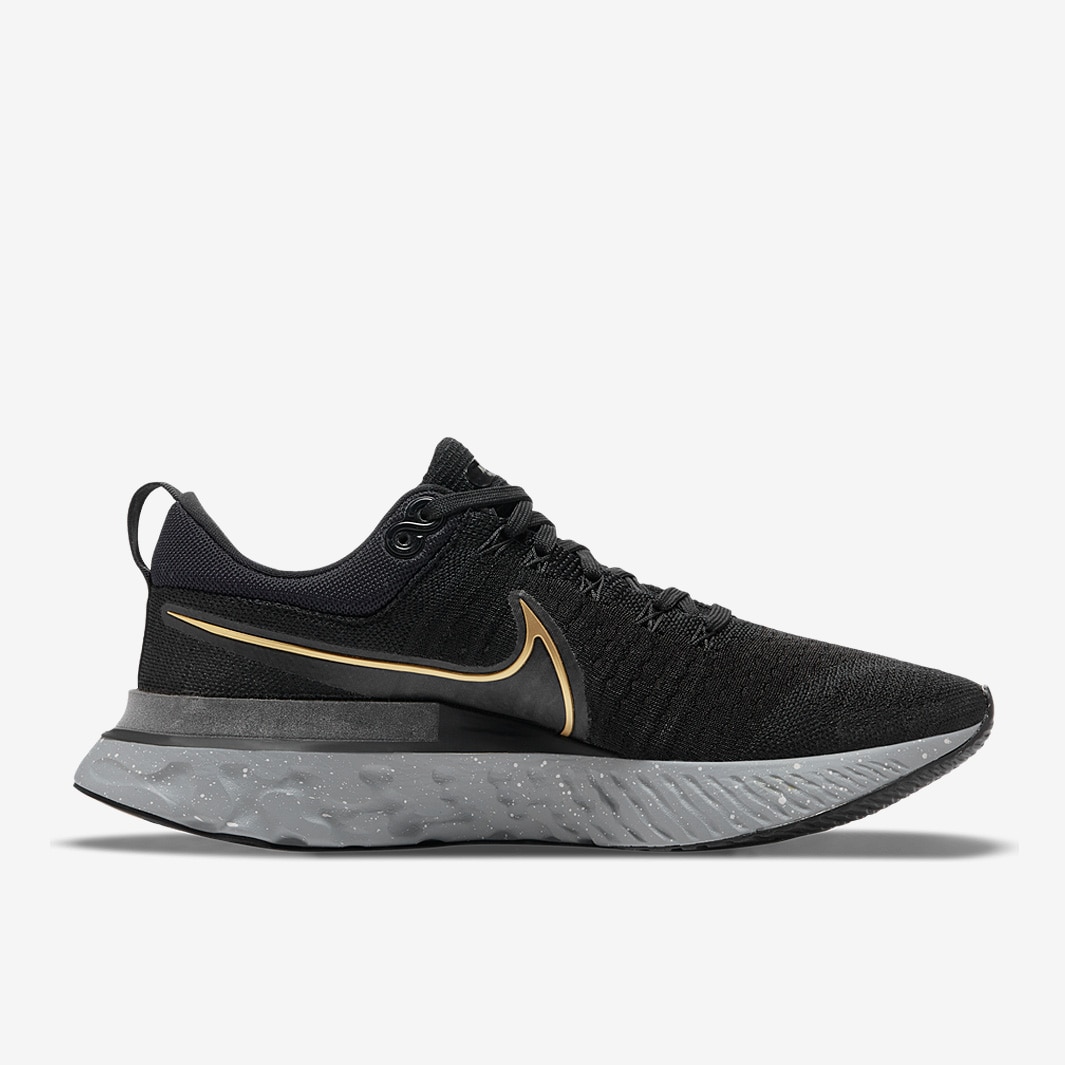 nike running legend react trainers in black and gold