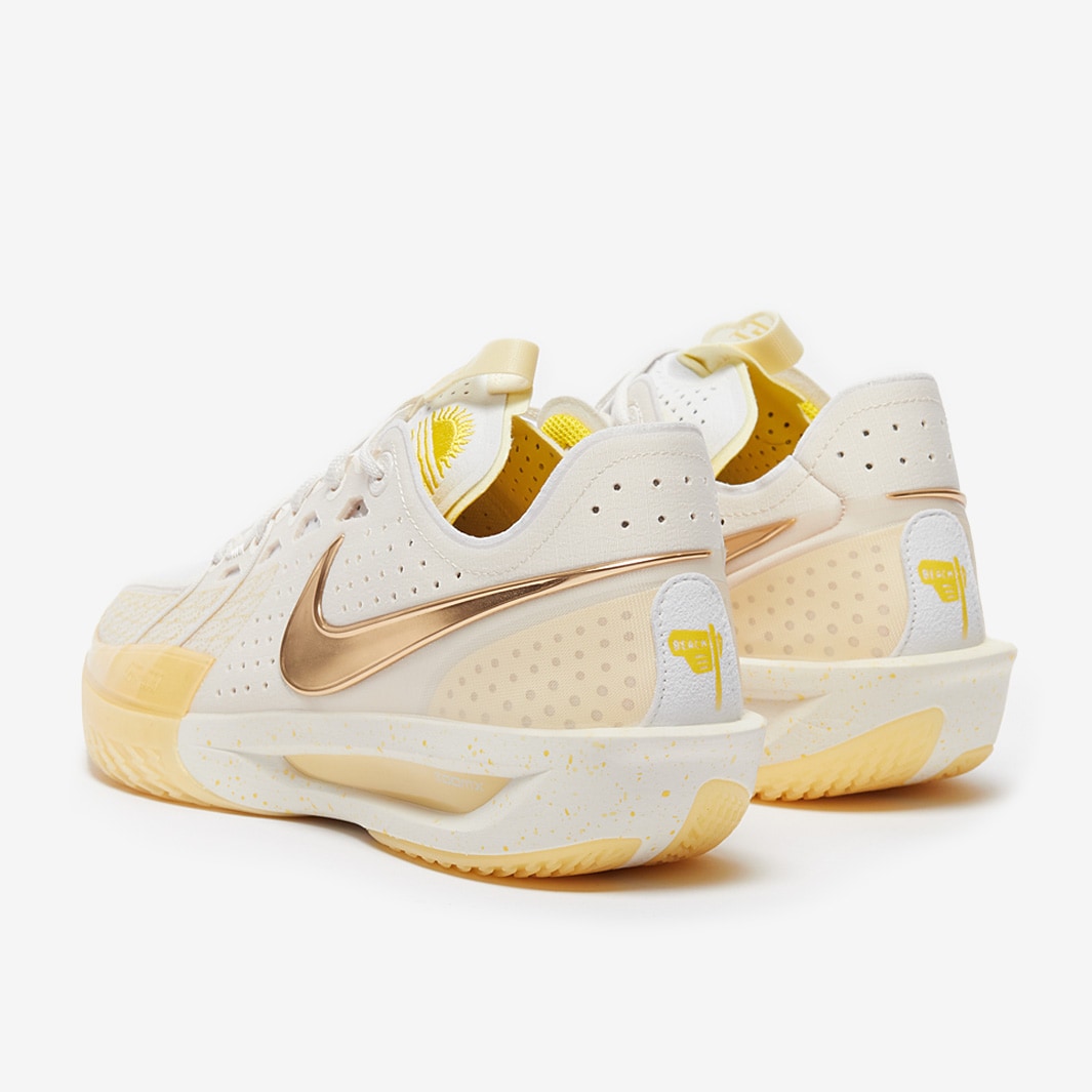 white nike basketball shoes with gold swoosh