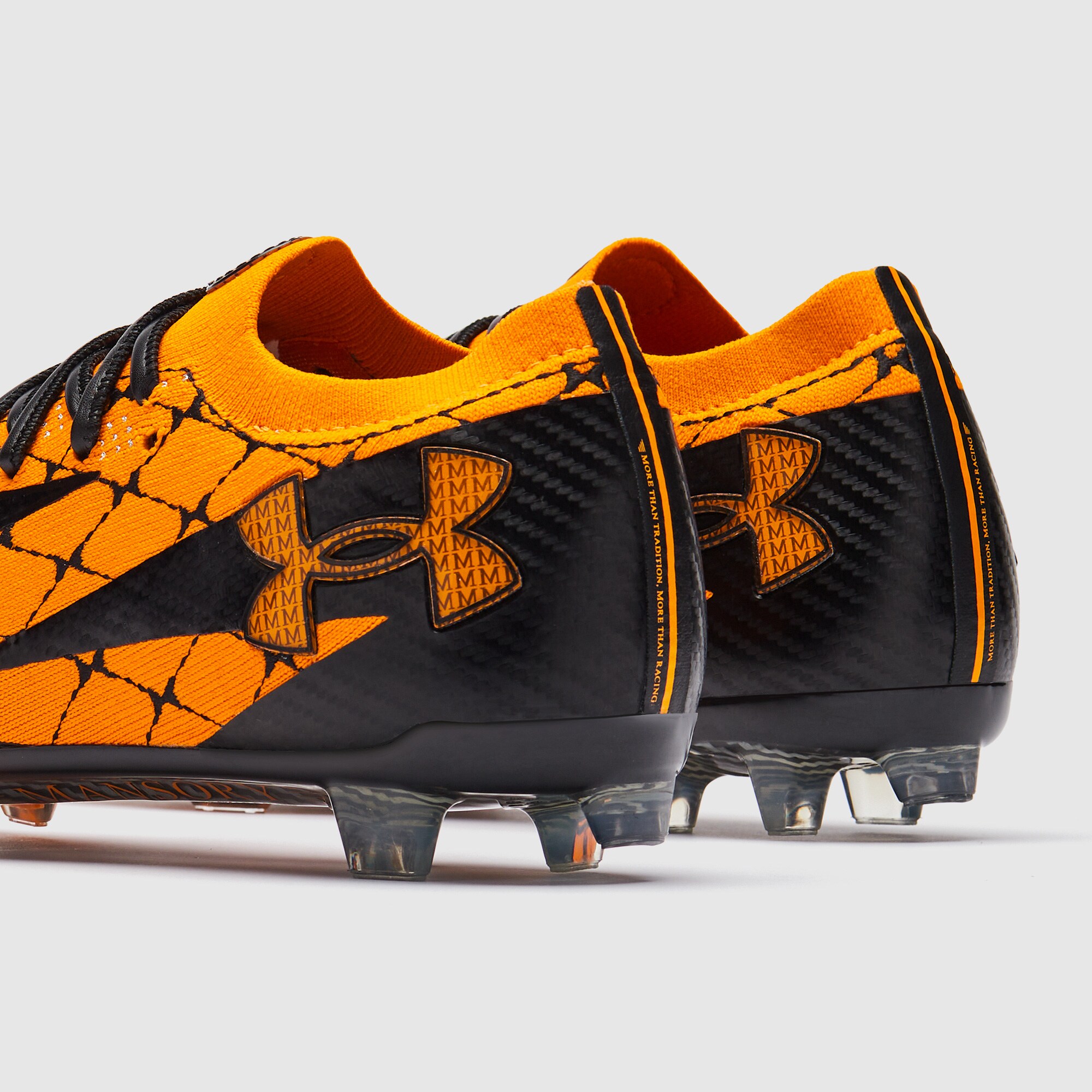 orange and black under armour football cleats