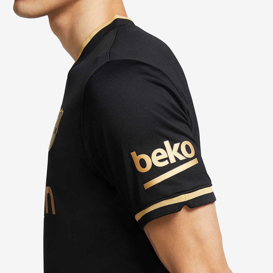 Barça unveil black and gold away kit