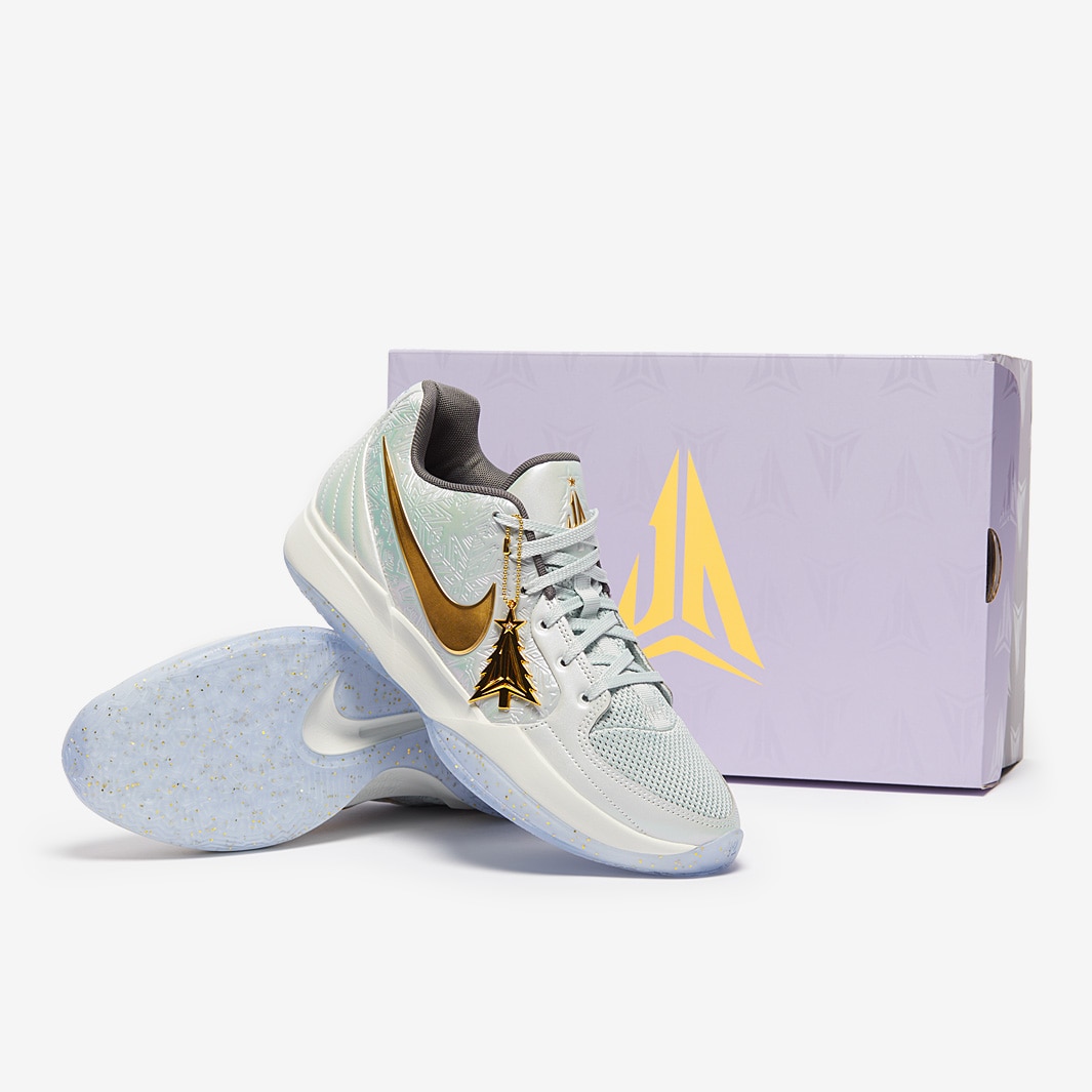 gold and white nike basketball shoes