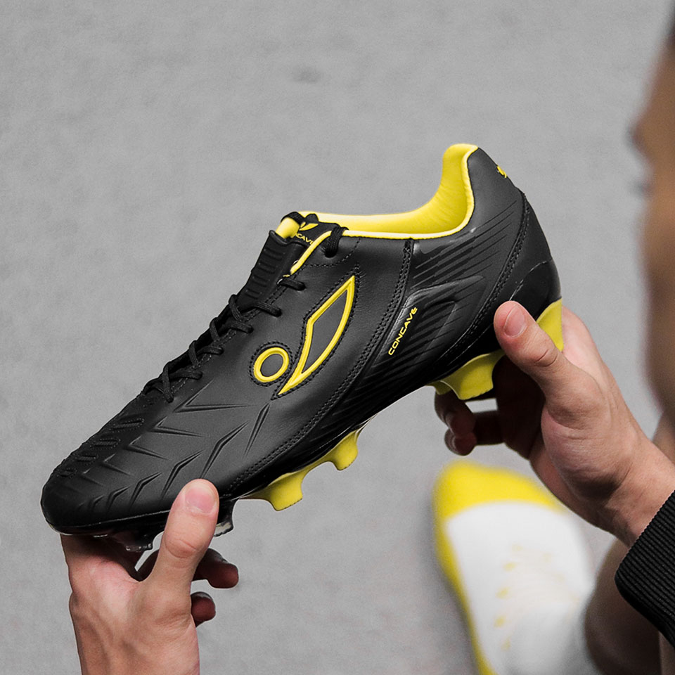 neon colored soccer cleats