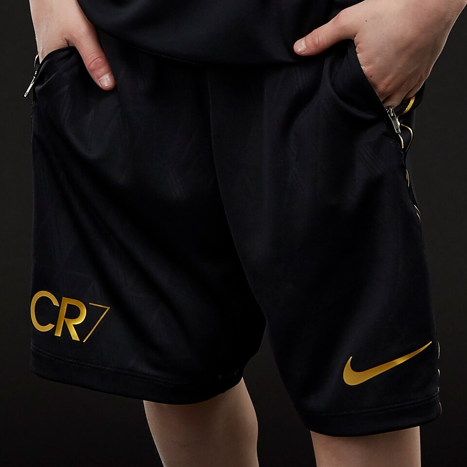 gold and black nike shorts