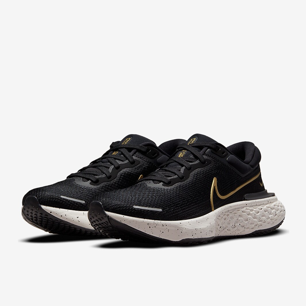 nike flyknit gold and black