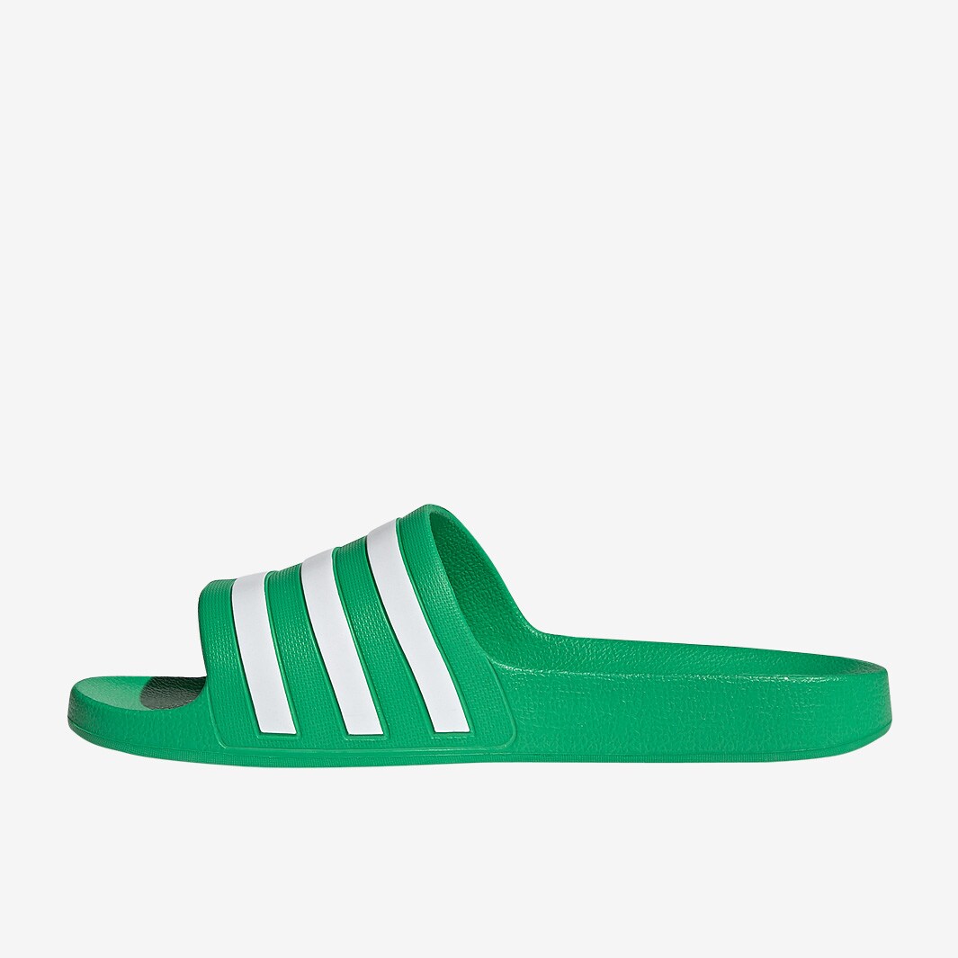 green and white adidas slides
