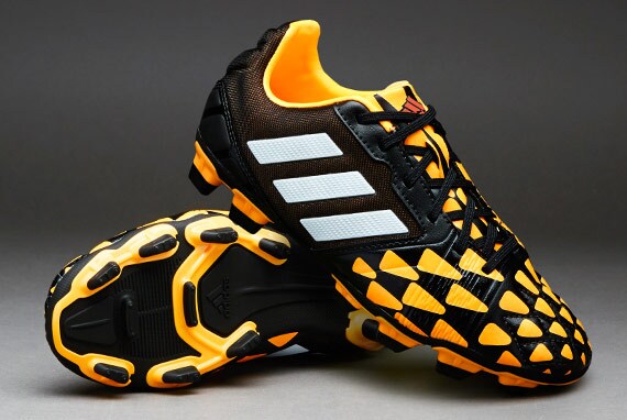 Botas de futbol adidas Nitrocharge 2.0 FG para niños- terrenos firmes Negro-Blanco-Naranja | Pro:Direct Soccer