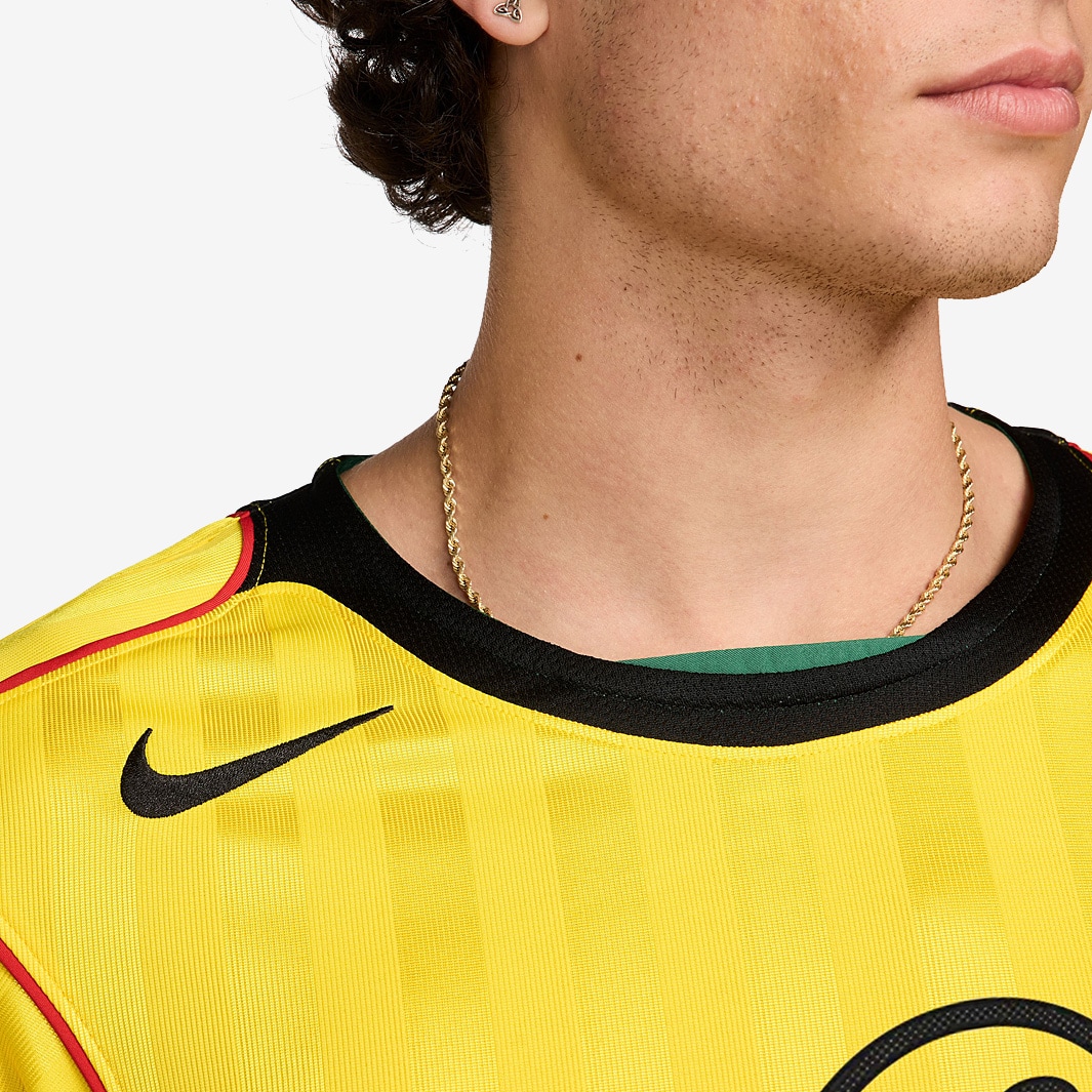 red black and yellow nike shirt