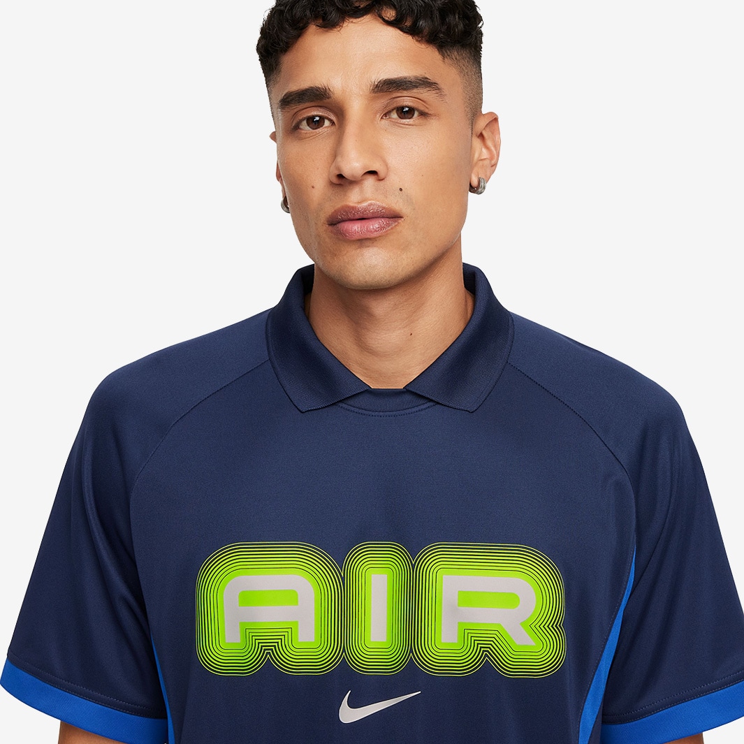 blue and green nike shirt