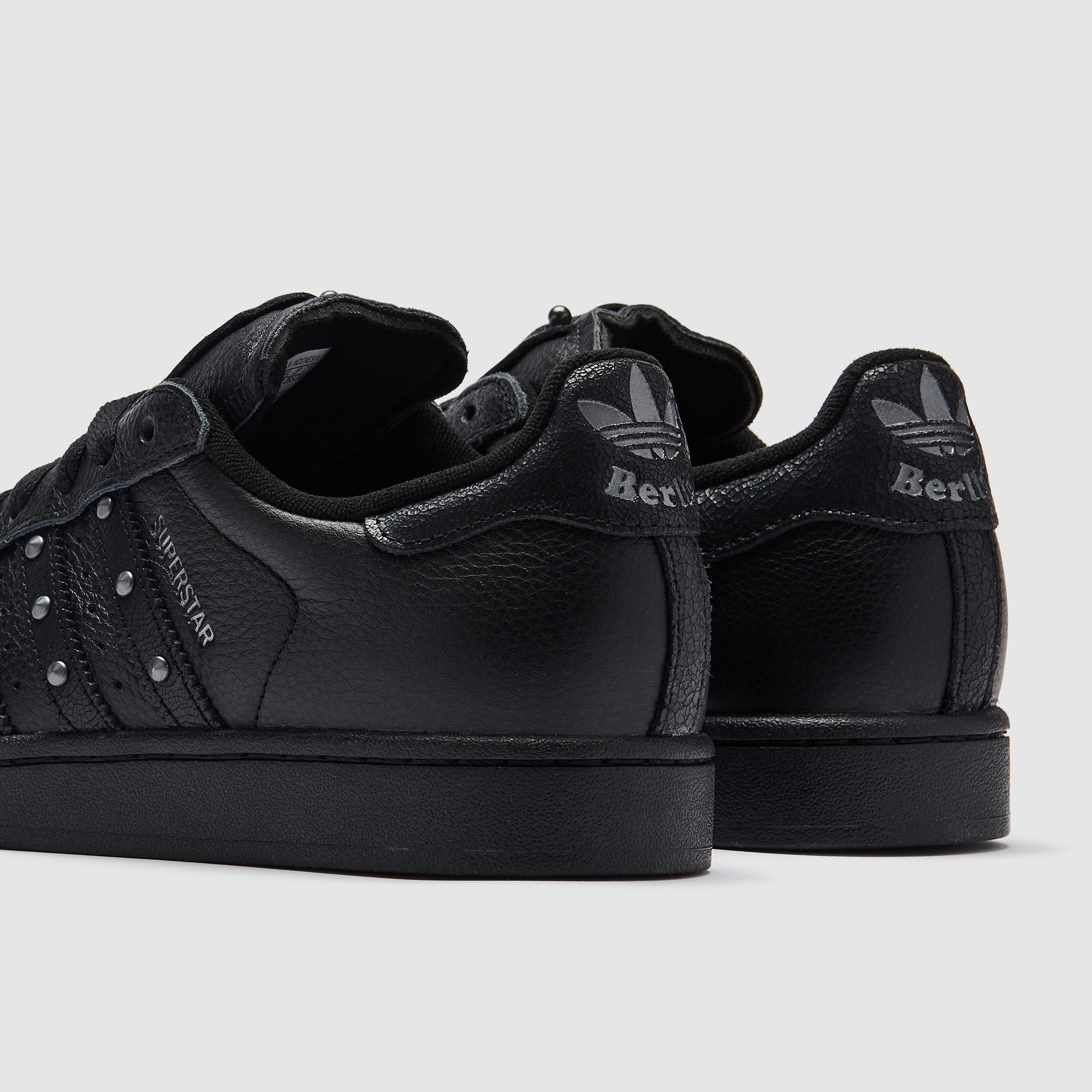 black leather adidas superstars