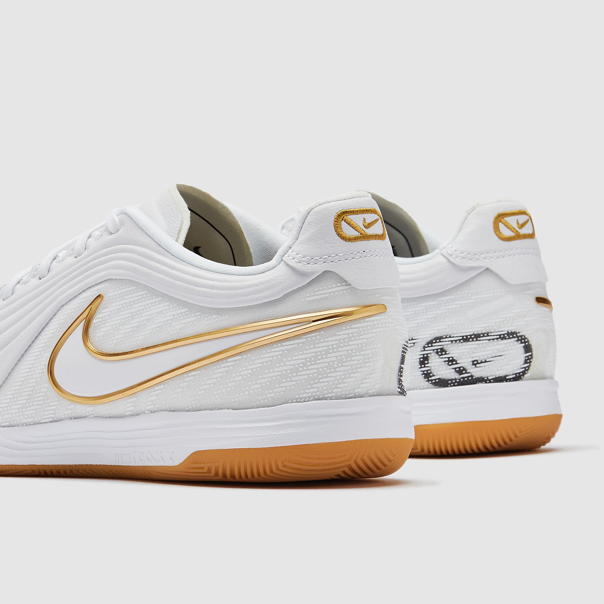 white and gold indoor soccer shoes