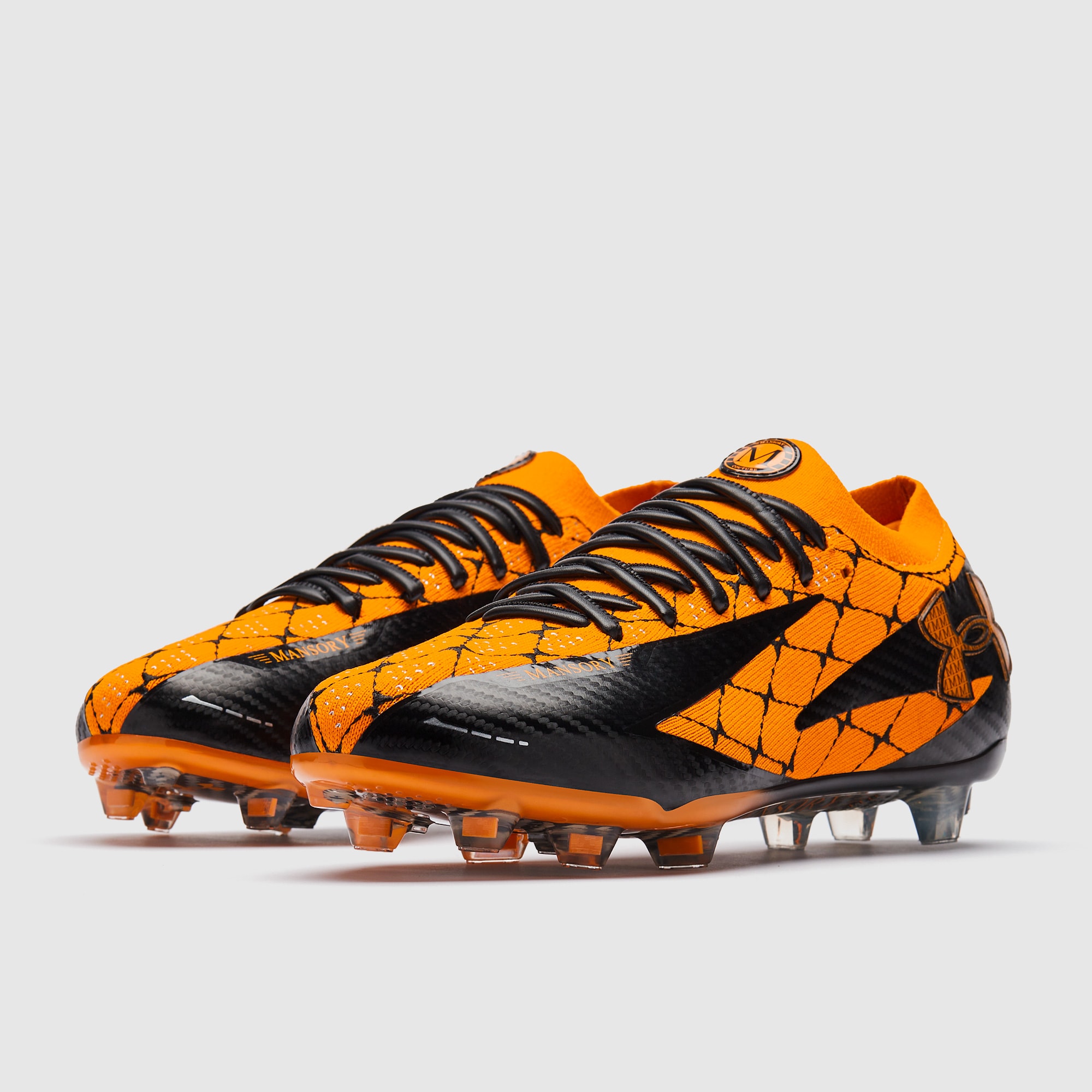 black and orange soccer cleats