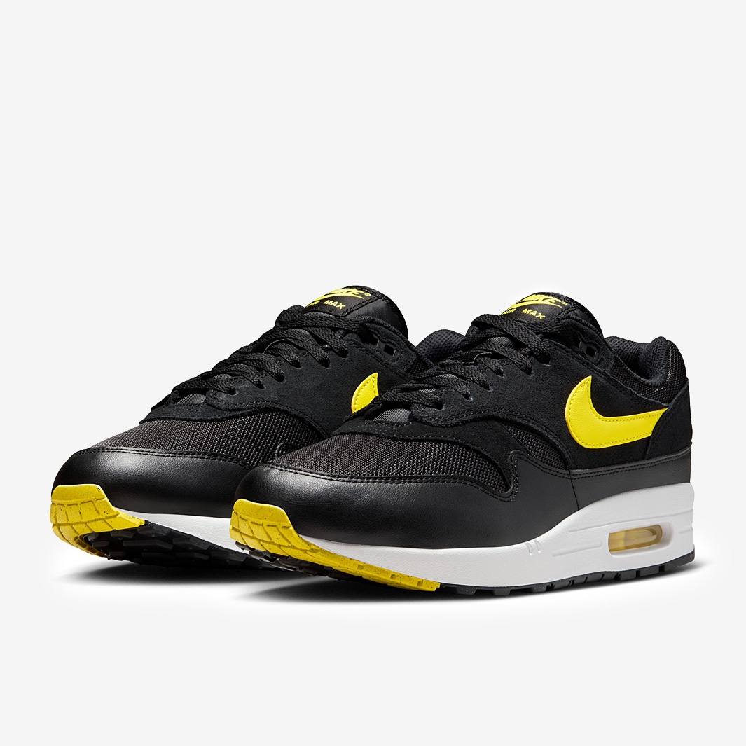 black and yellow nike shoes
