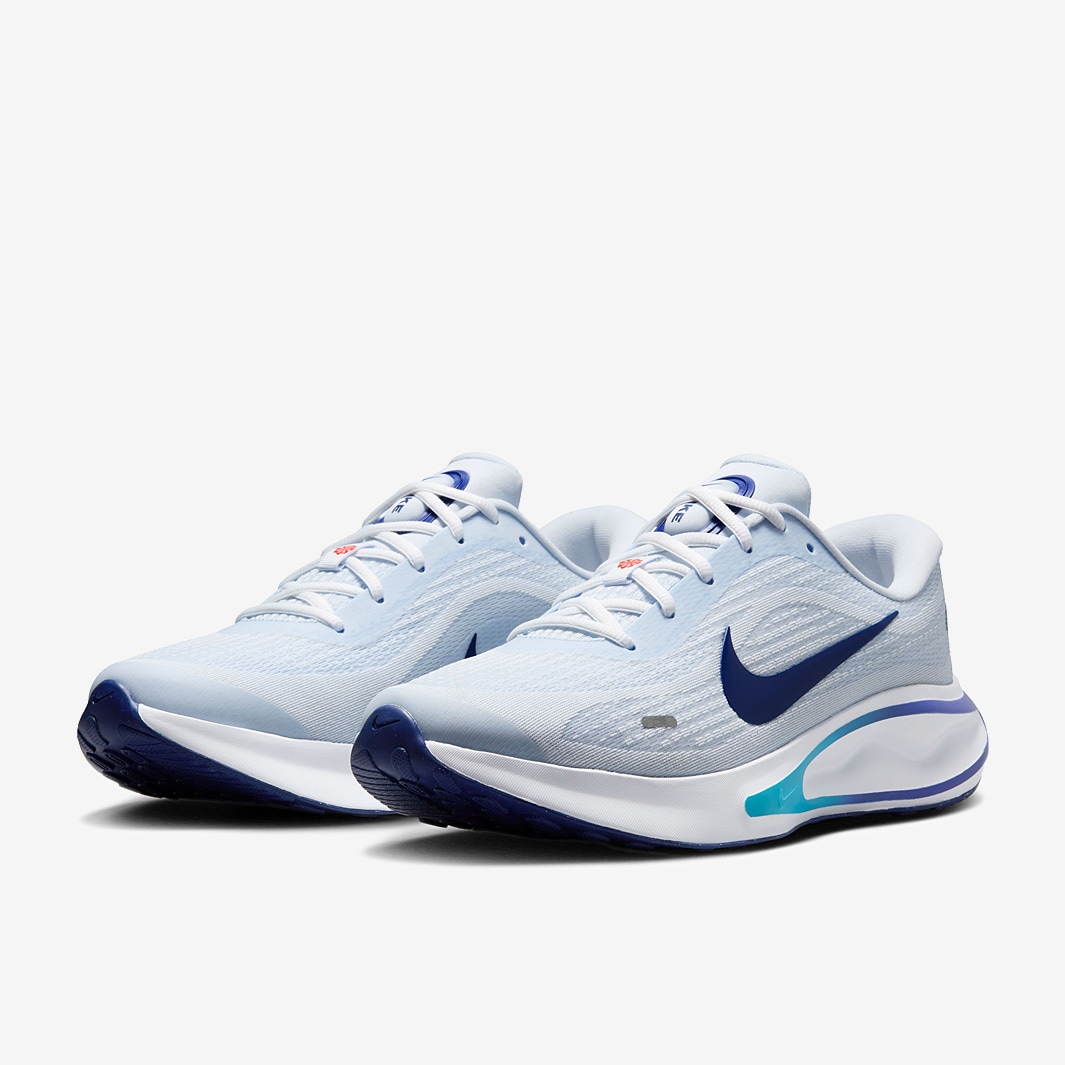 blue and white nike running shoes