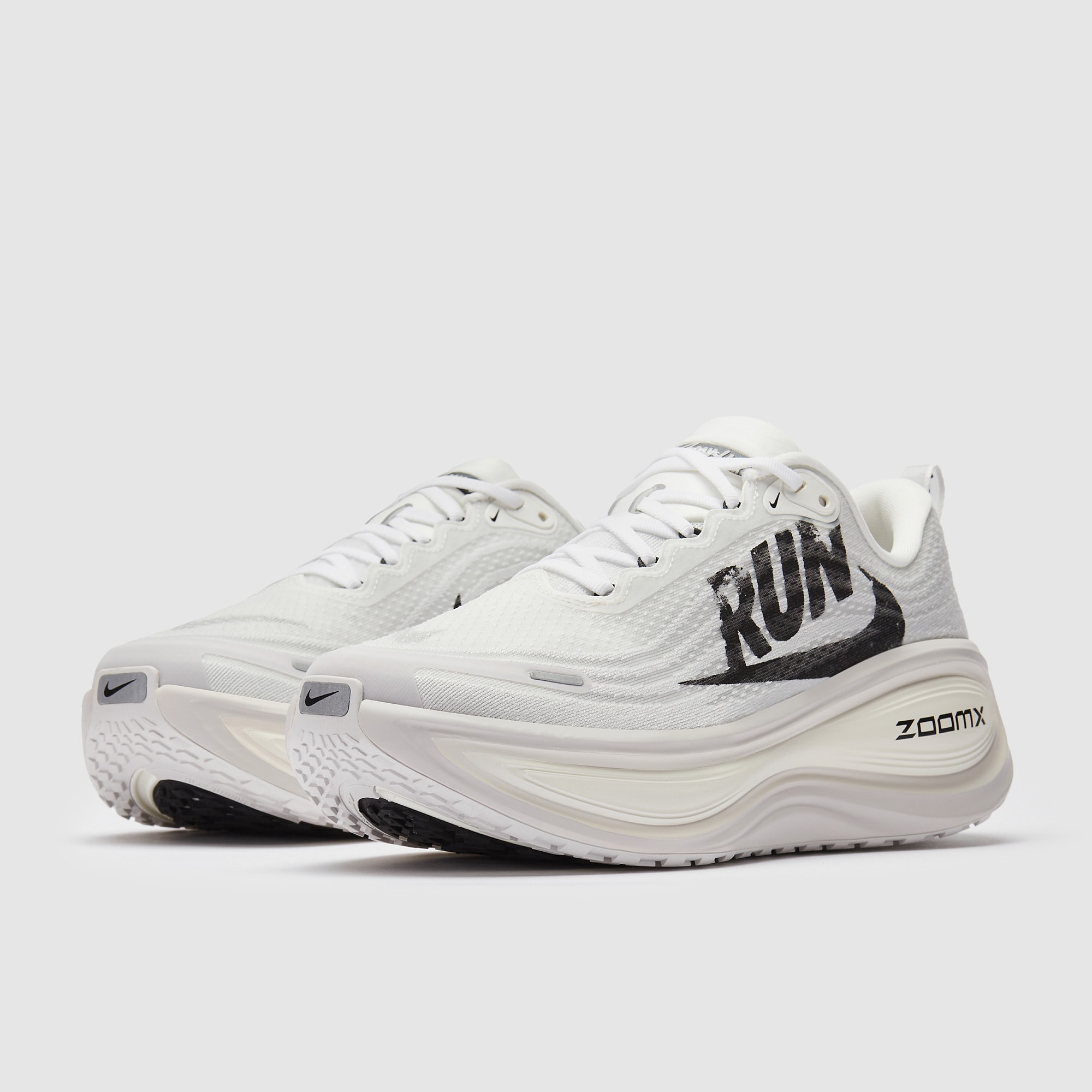white and gray nike running shoes